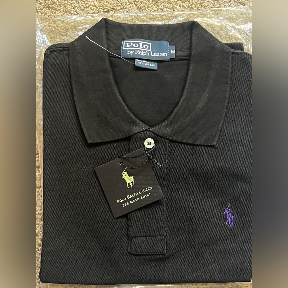 Ralph Lauren polo shirt medium 
New with tags never worn, black, purple emblem
